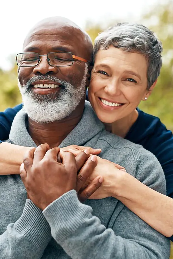 CJC-1295-Peptide-Treatment A mature couple embraces outside. Get CJC 1295 anti-aging peptides from Better Life Carolinas of Charlotte in Charlotte Metro.