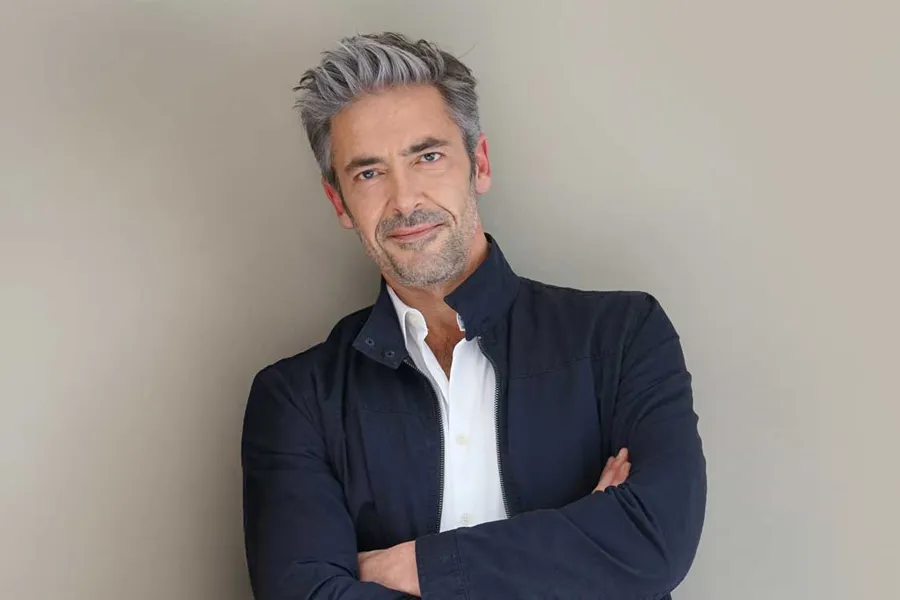 Mens-Health-Clinic A healthy middle-aged man standing against a wall. Schedule a men's health consultation from Better Life Carolinas of Charlotte in Charlotte Metro.