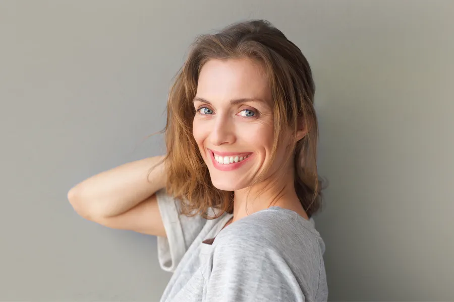 Womens-Health-Clinic-3 A beautiful brunette woman touching her hair. Schedule a women's health consultation from Better Life Carolinas of Charlotte in Charlotte Metro.